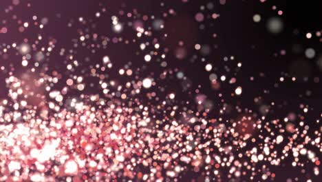 Rose gold glitter sparkles texture on dark background. Shiny abstract animation.