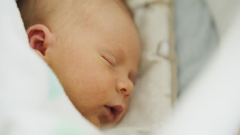 close-up of newborn baby face after birth