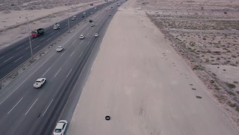 desert highway traffic aerial footage – fly forwards