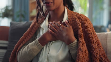 a woman expressing gratitude with her hands on her chest