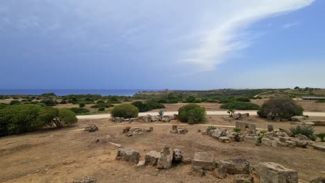 panning seafront view of remains at selinunte archaeological park on sicily coastline, italy