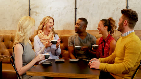 group of happy friends interacting while having coffee 4k 4k