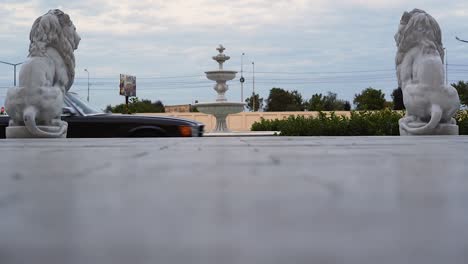 stops the car between two statues