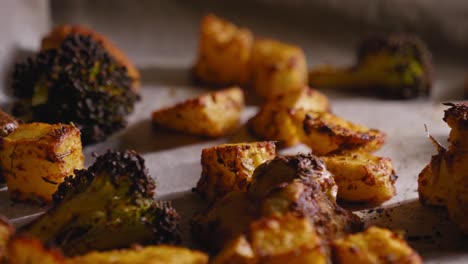 Close-up-View-of-Roasted-Vegetables-on-a-Baking-Sheet---Panning-Shot