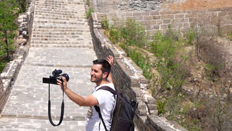 travel content creator explains jinshanling section of great wall of china in beijing on camera