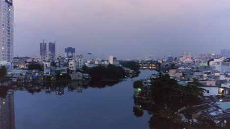 atmospheric cinematic truck shot from drone flying across a lake with perfect mirror reflections at either dawn or dusk