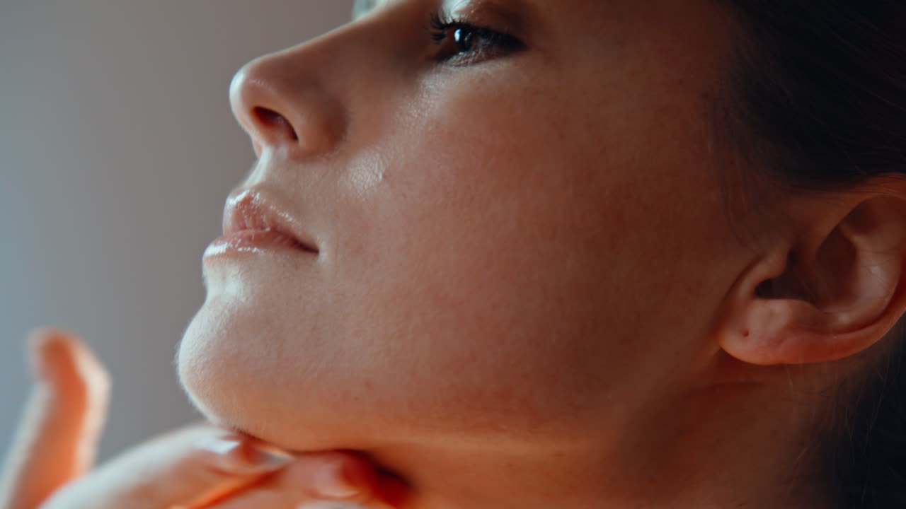 Lady hands massaging face at daily skincare routine closeup. Woman massage