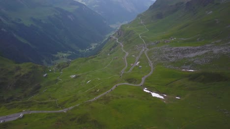 winding road on klausen pass, swiss alps