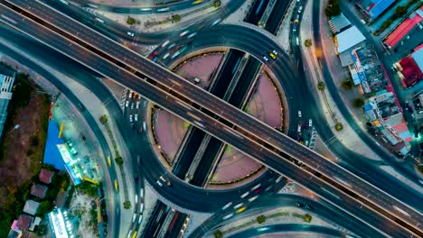 time lapse roundabout road junction and city transport at night, road traffic an important infrastructure in thailand. expressway top view