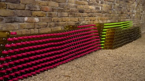 inside a white wine bricked cellar alcohol collection, drinks products displayed