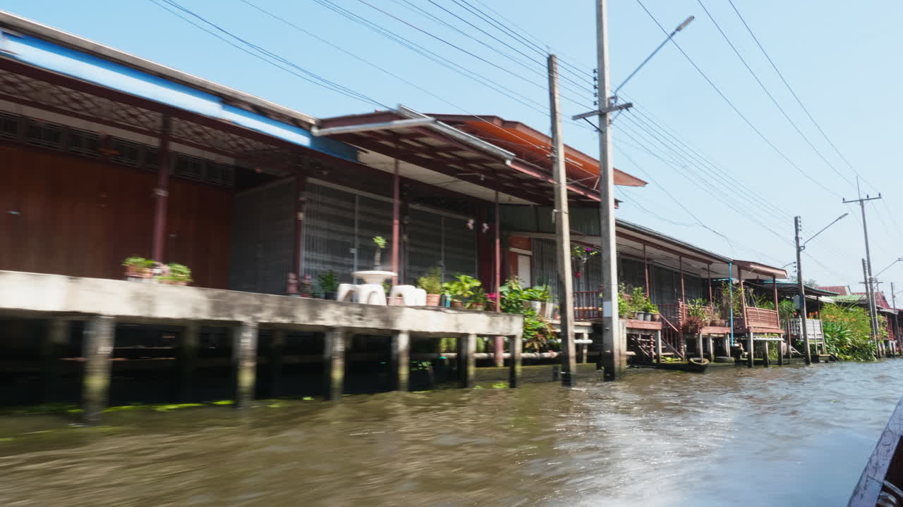 Floating Houses on a Canal in Thailand