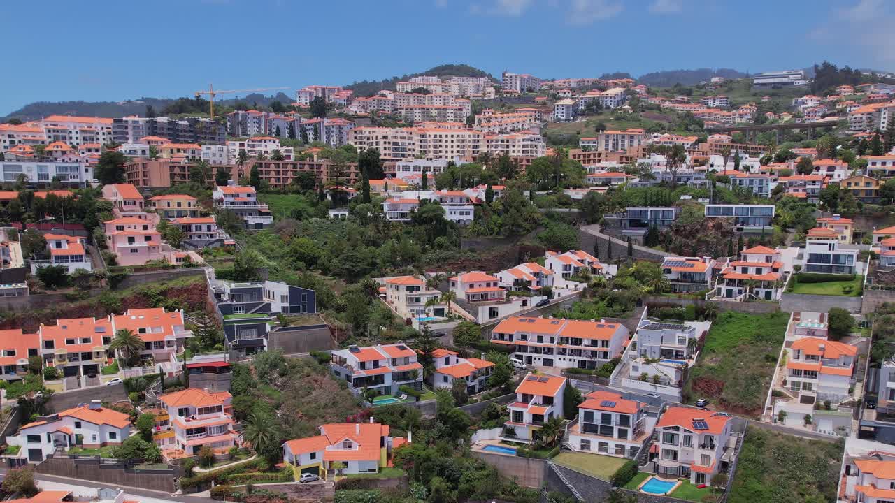 Beautiful aerial view of Madeira's vibrant hillside homes