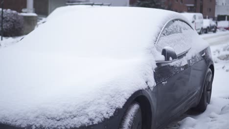 Car-Parked-In-The-Street-Covered-With-Snow-At-Wintertime-In-Olso,-Norway