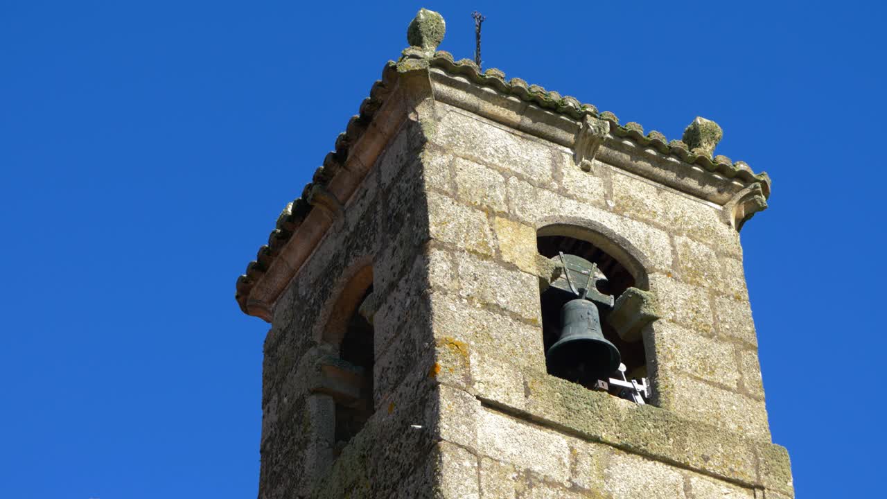 Stone bell tower of Santa María de Parada de Outeiro church in Vilar de Santos, Galicia, Spain