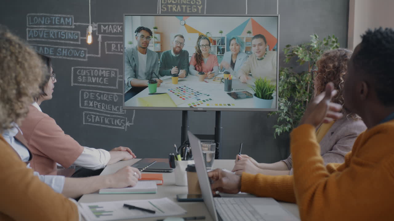 Business Team Meeting via Video Conferencing