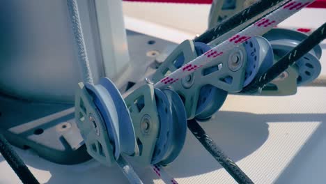 ropes on moving pulleys in a sailboat - close up