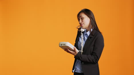 business manager answers landline phone call