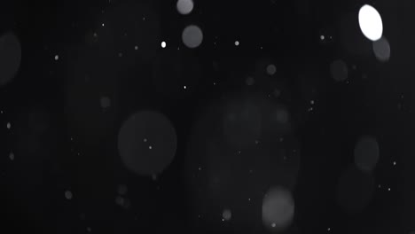 floating abstract particle bokeh on dark background