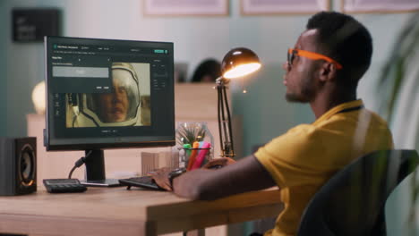 person editing photos on a computer