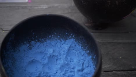 camera-panning-over-bowls-made-out-of-coconuts-with-color-powder-in-different-colors