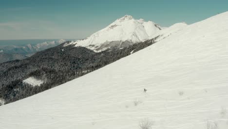 snowboarder on ski resort fresh powder snow slopes in russia