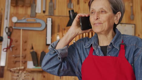 female luthier at work in her workshop