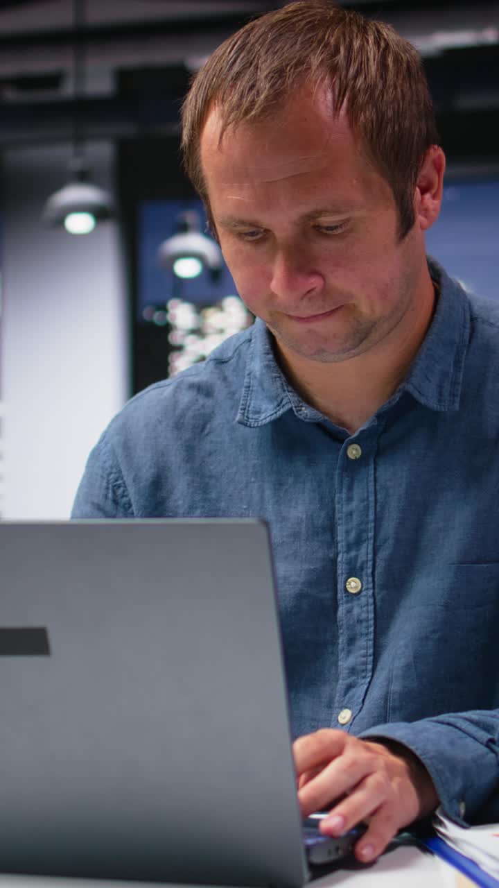 Vertical Video Business manager in modern workplace sharing insights and reports