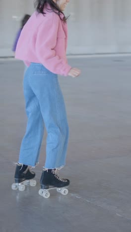 woman in pink jacket dancing energetically in a large indoor space