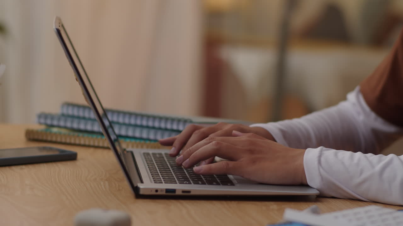 Hands of Student Typing on Laptop at Desk