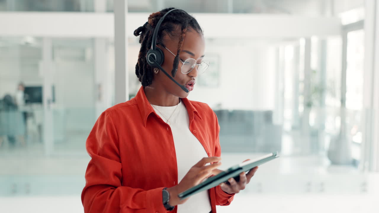 Woman with Headset and Tablet in Office