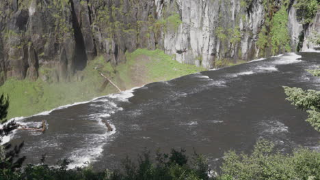 still shot from afar of the big springs in upper mesa falls in idaho, usa