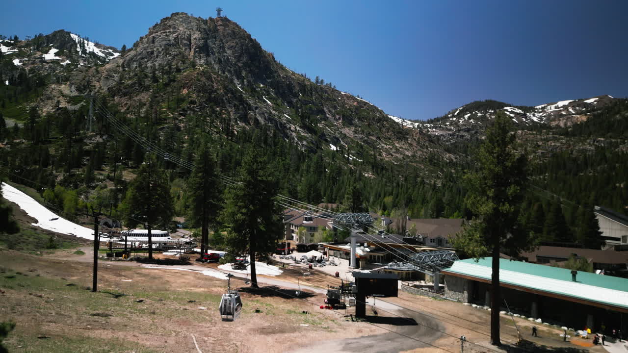 Aerial drone footage flying over dense pine forest at Lake Tahoe, California. Bird's eye view of treetops in Sierra Nevada mountains. Perfect for nature documentaries and California travel content