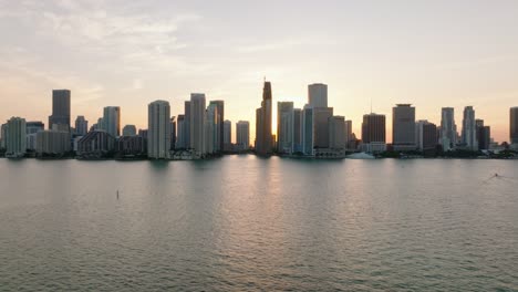 beautiful view of modern high rise residential buildings on waterfront. romantic view against setting sun. miami, usa