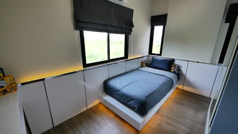 compact bedroom decoration idea with single bed and built-in cupboards