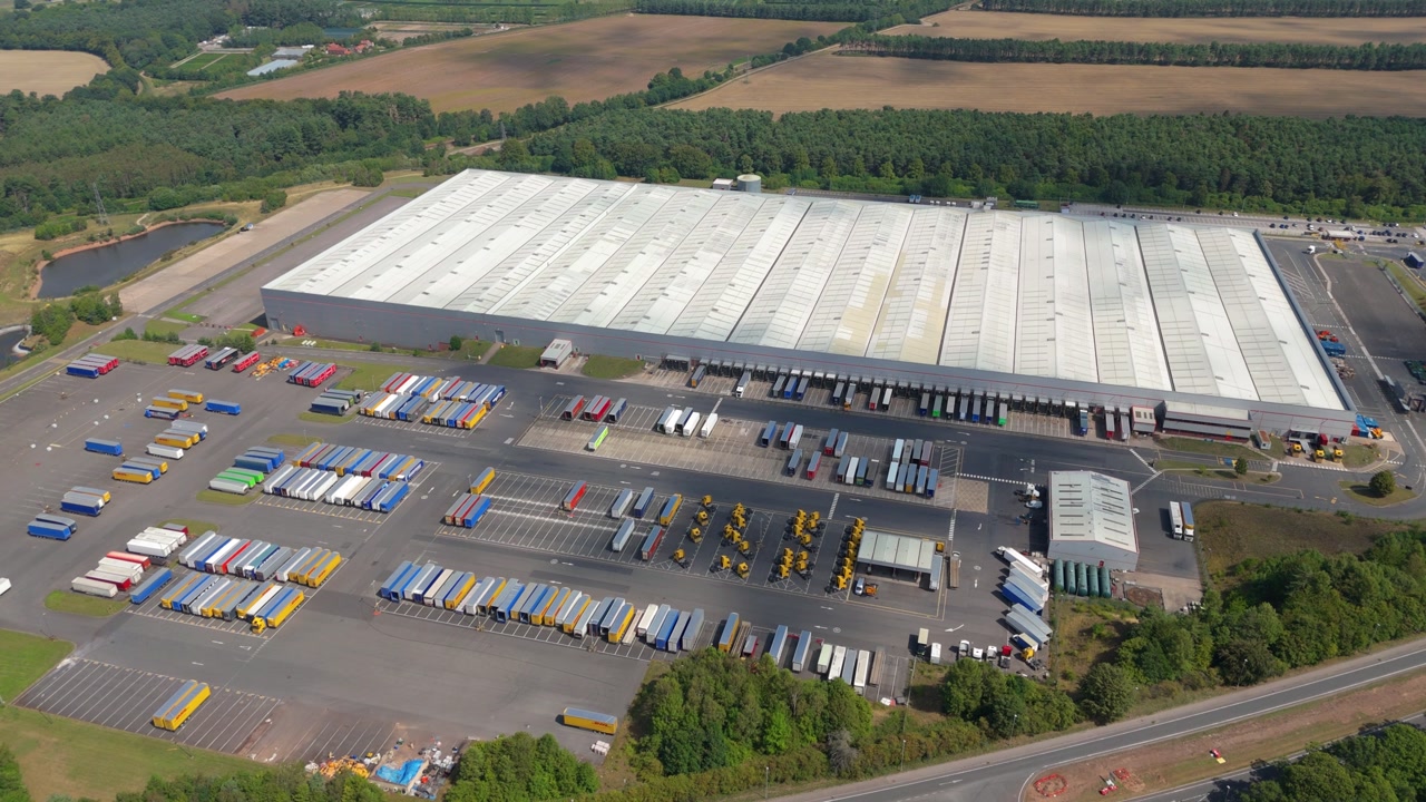 Wide aerial drone view of warehouse complex and business district near Sherwood Forest Nottingham England UK