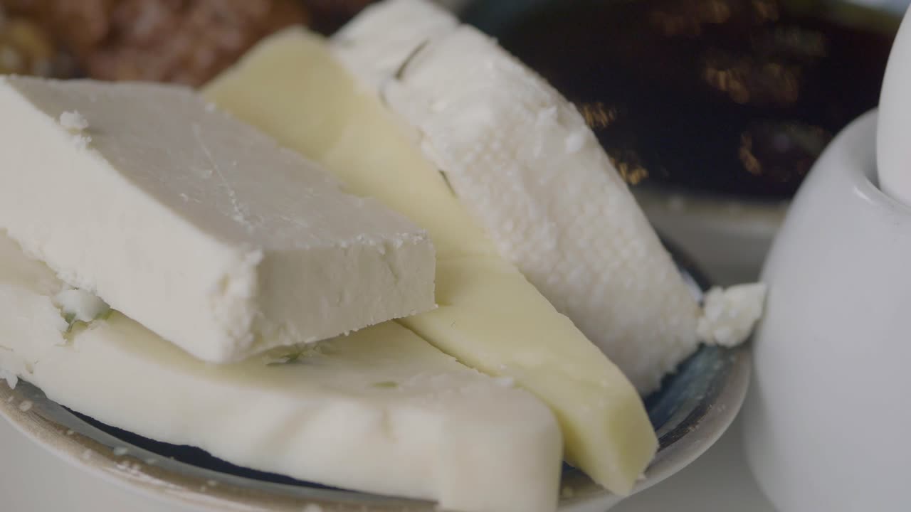 Close-up of Various Cheeses Served on a Plate for Breakfast