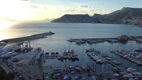 calpe spain view of the marina and fishing harbour from pena de ifac on a bright winter evening