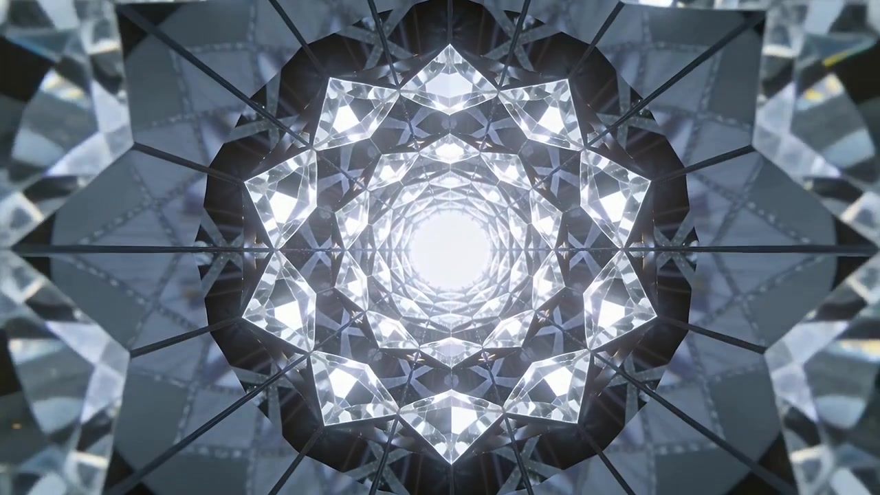 Inquadratura che avanza in un tunnel di prismi rotanti verso un nucleo luminoso in una camera a specchi, mostrando bagliori e giunture.