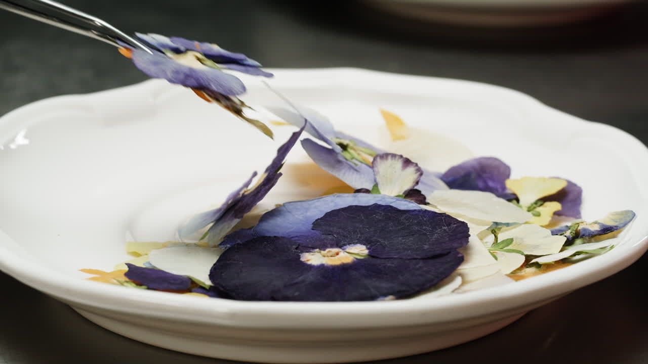 Preparing a dish with edible flowers