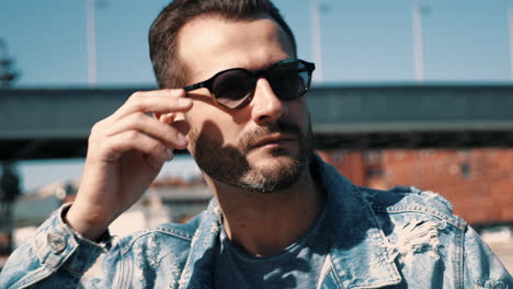 man in denim jacket and sunglasses