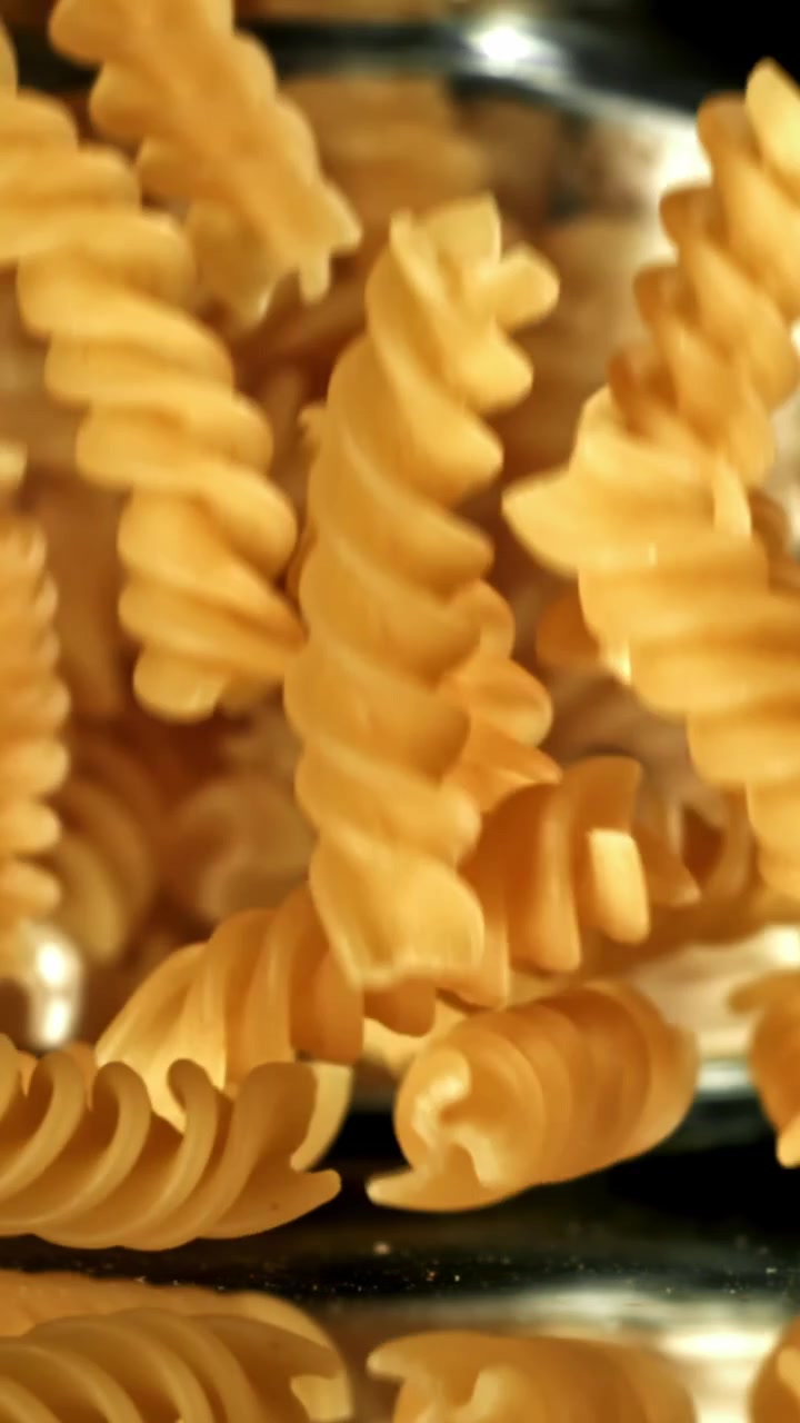 Dry Fusilli Pasta Falling in Slow Motion