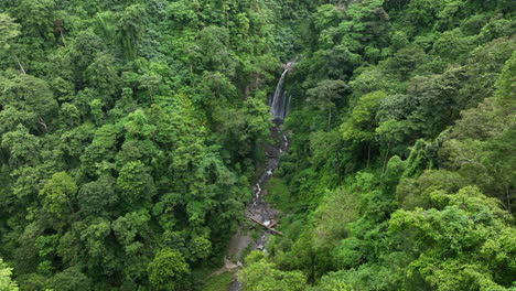 aerial views over tiu kelep waterfall on the island of lombok, indonesia