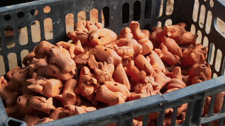 Ethereal view of asian clay figurines placed into crate Than Ha Hoi An Vietnam
