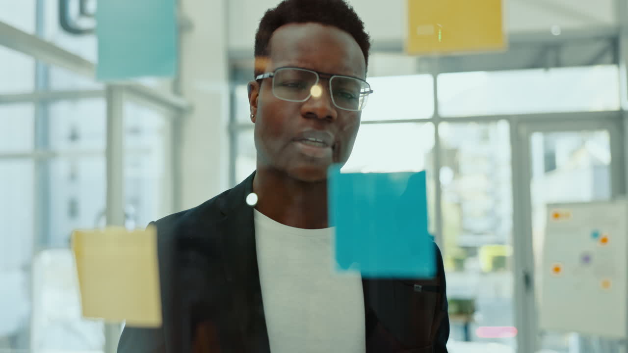 Thinking, glass and business black man with sticky