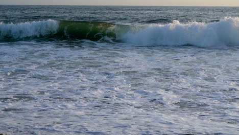 slow-motion footage of waves crashing on the california coast