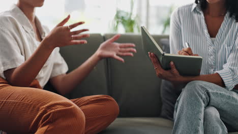 women in conversation, taking notes