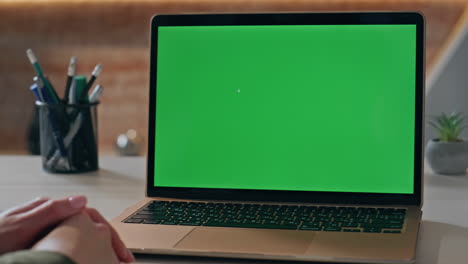 unrecognizable entrepreneur looking green screen laptop at workplace close up.