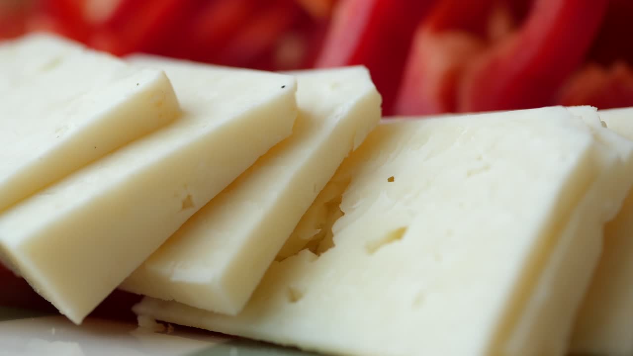Cheese slices with red pepper