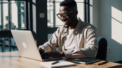 man working on laptop in office