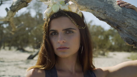 young female model portrait w- mermaid crown gazing, beach, close up